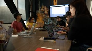 Butler Team meeting in a conference room on projects.